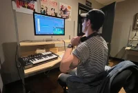 person exploring career paths in livestreaming with laptop camera and microphone